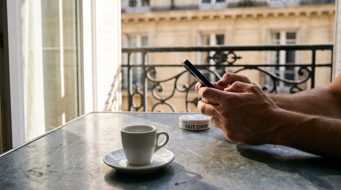 Hands placing a nicotine pouch order beside a zinc café table in a Paris apartment