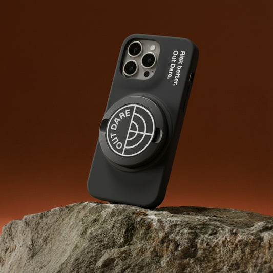 OutDare iPhone 16 Pro Max case in black with the OutDare grip, on a rock
