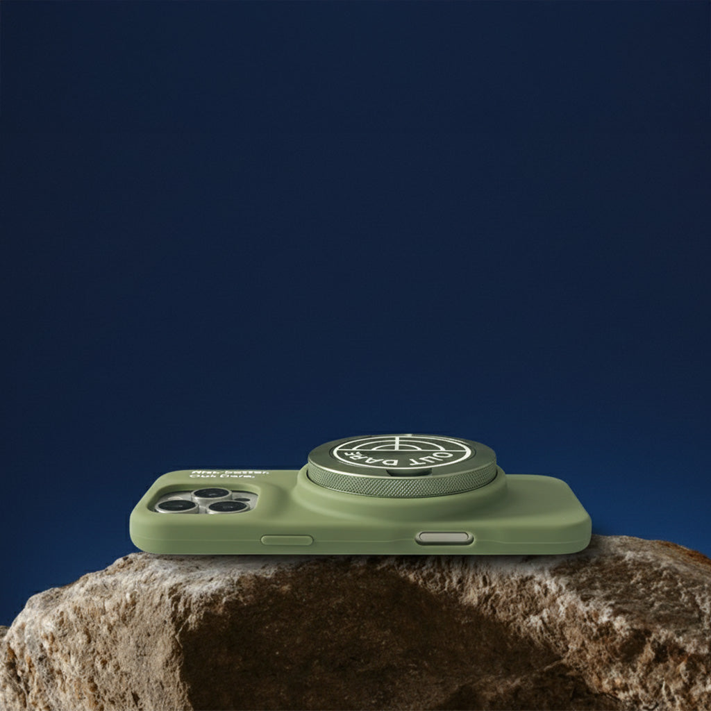 OutDare iPhone 16 Pro Max case in green lying on a rock