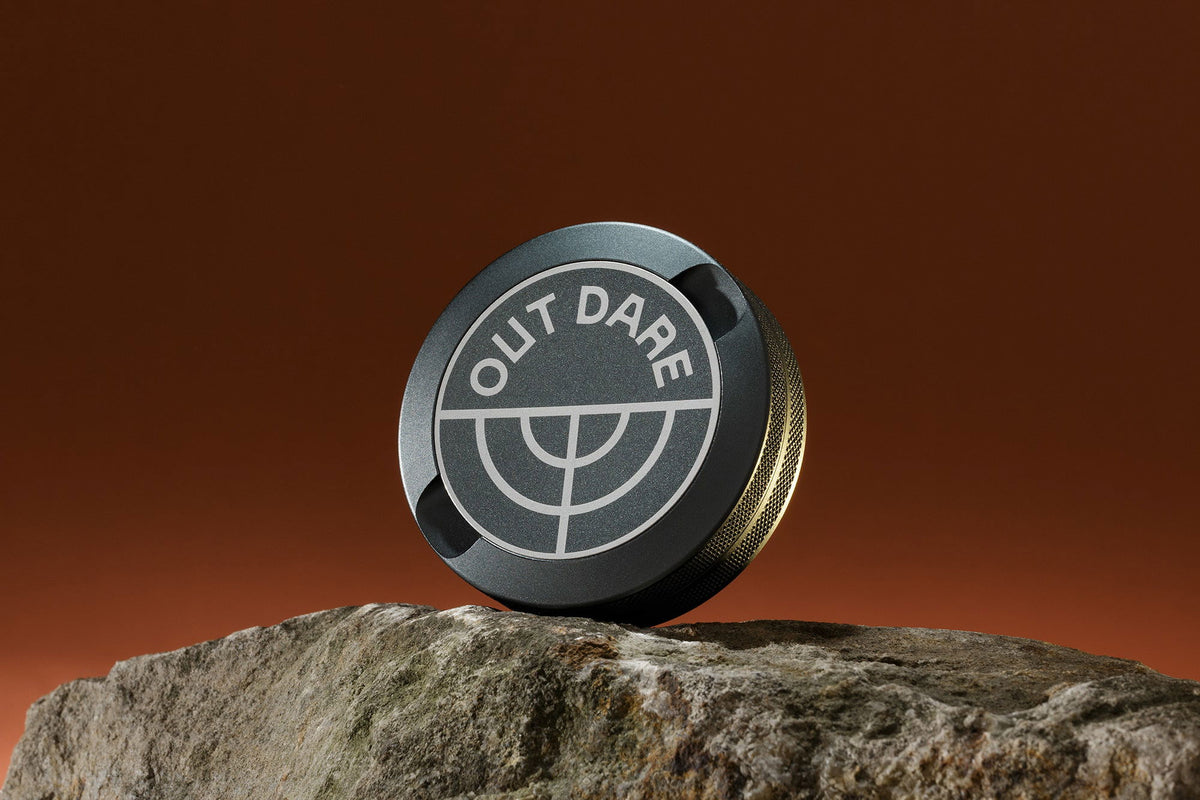 Silver OutDare metal can on a rock